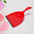 Dustpan set with long handle for easy cleaning.