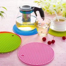 Silicone hot mat featuring a simple design for use under hot pots and pans.